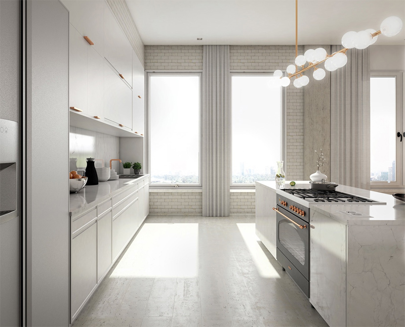 Phòng bếp trắng tinh làm nền nổi bật lên chi tiết đèn trần và tay nắm mạ vàng