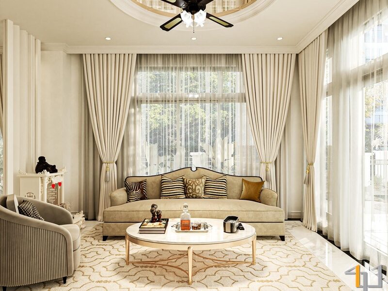 Bộ sofa văng và ghế đơn được sắp xếp quây quần quanh bàn trà oval, đặt cạnh hệ cửa kính lớn kịch trần