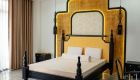 Giường ngủ và vách đầu giường phong cách Indochine kết hợp đèn LED