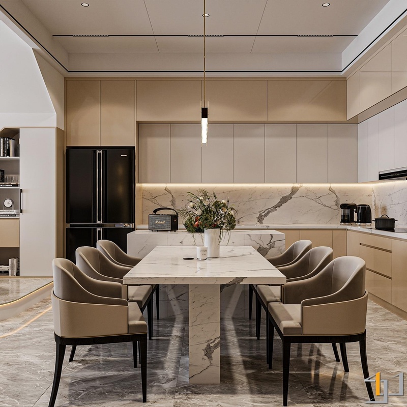 Hệ tủ bếp trên -dưới hoàn toàn không tay nắm và đồng bộ màu sắc với bàn ăn mang lại sự thoải mái cho tâm trí người đứng bếp