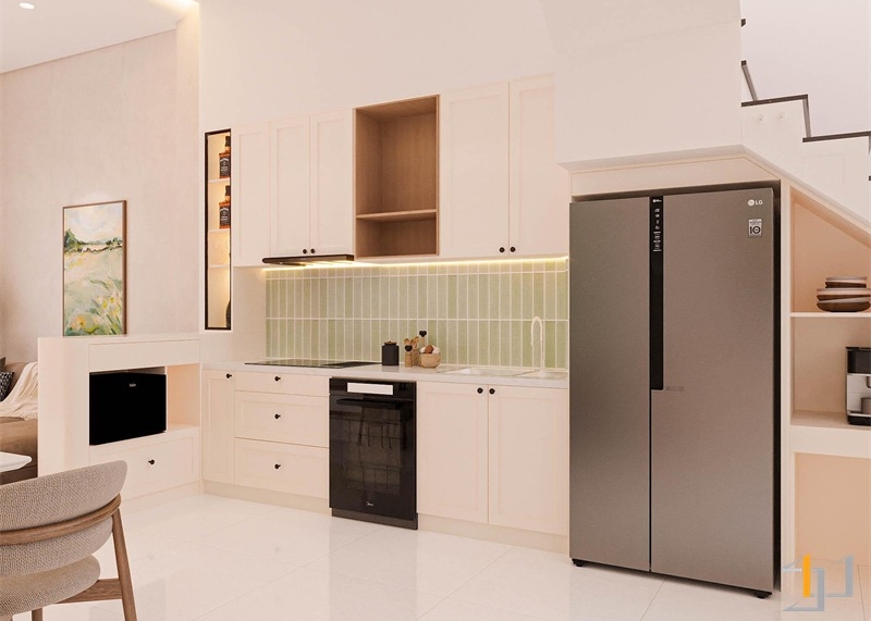 Nhà bếp được thiết kế với hệ tủ phủ laminate trắng nhám chống bám vân tay