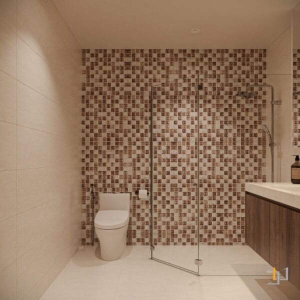 Khu vực tắm được ngăn cách bằng vách kính cường lực, trong khi bồn rửa mặt được thiết kế treo tường với tủ gỗ vân tối màu bên dưới